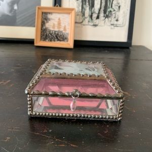 A crystal trinket box with mirrored bottom